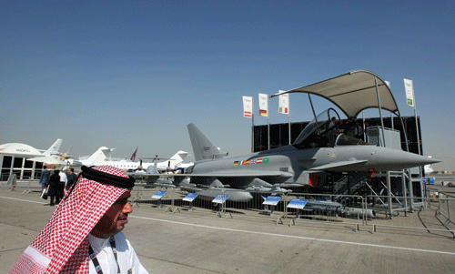 PC-A-visitor-walks-past-a-Eurofighter-Typhoon-jet-displayed-at-the-Dubai-Airshow-in-the-Gulf-emirate-on-November-15,-2009